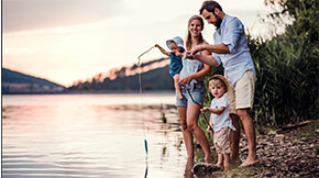 family of four fishing together