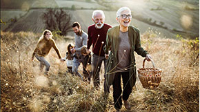 elderly group walking through corn field