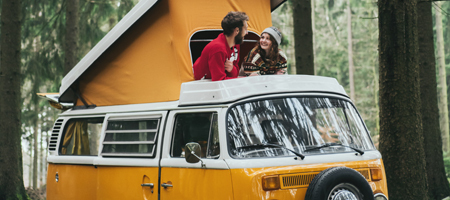 couple standing in a camper van