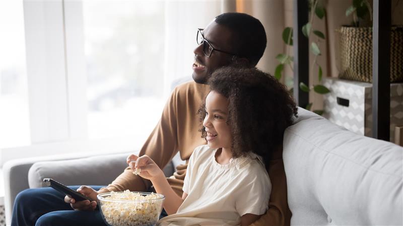 three women with rolling luggage at Hertz location