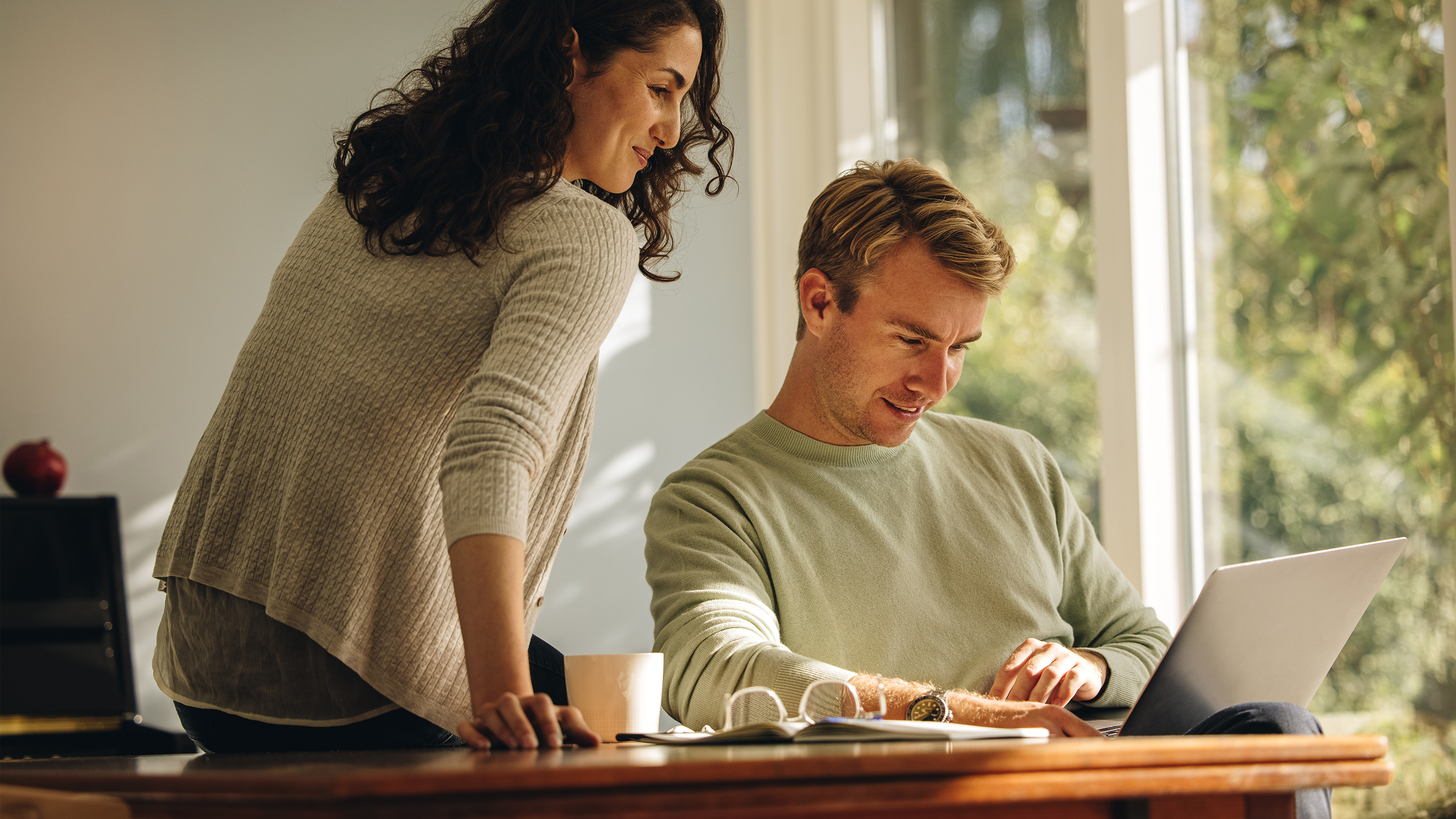 family happy excited riding roller coaster, older kids in front, parents in back seats